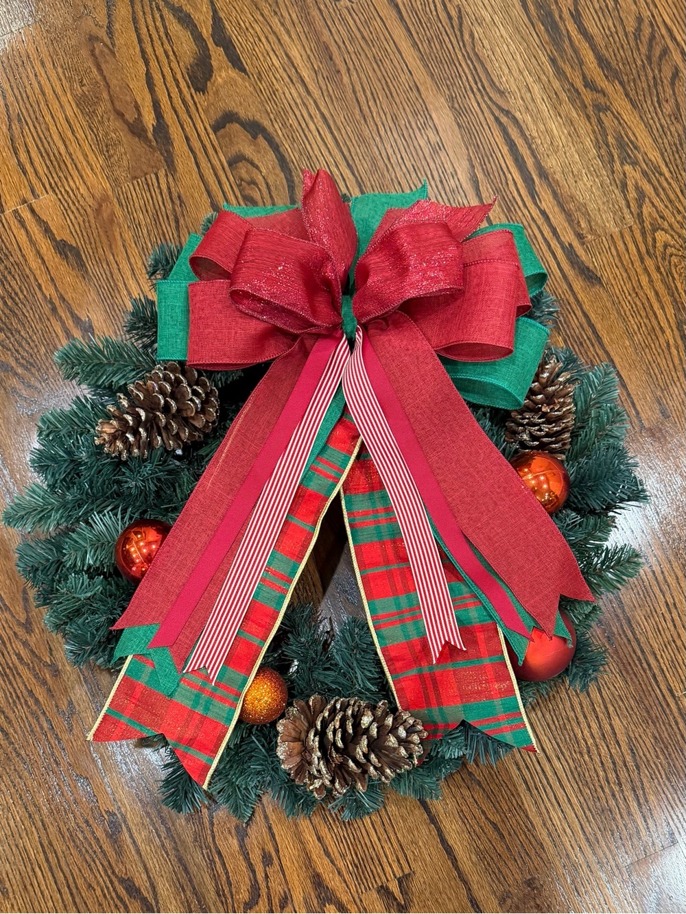 Classic Red & Green Holiday Wreath with Decorative Bow and Pinecones